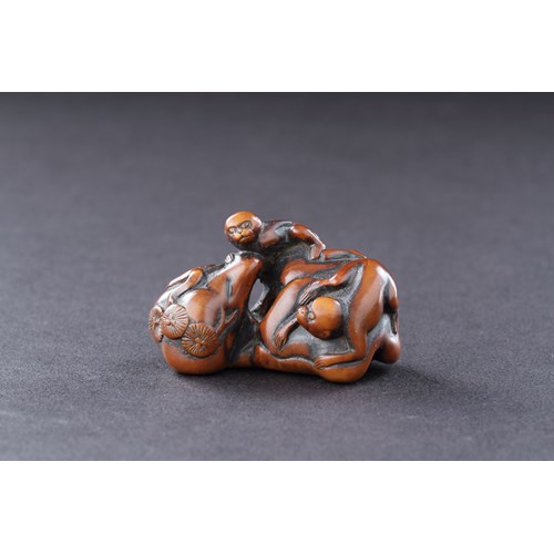 Japanese Boxwood Netsuke of Two Monkeys Climbing over a Rock with Bonsai Prunus Trees